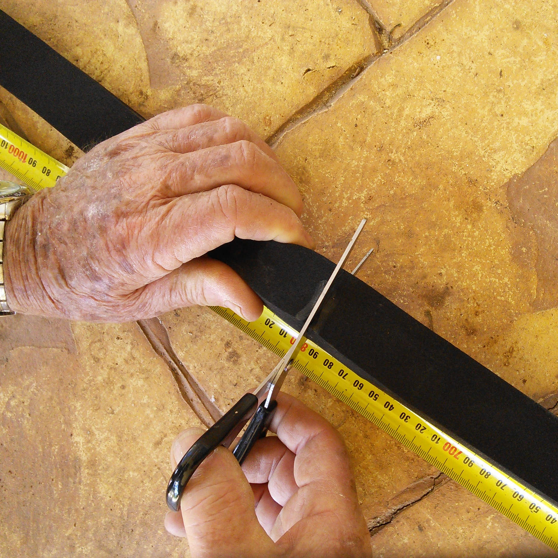 Cutting Adhesive Neoprene Foam Tape with normal household scissors